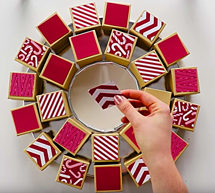 Learn how to make a beautiful advent calendar with cardboard boxes.
