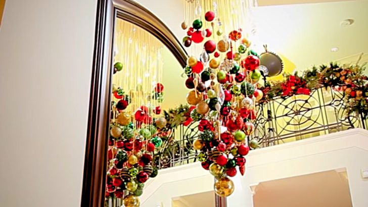 Learn to make this DIY Christmas Ball Chandelier with wood, string and ornaments