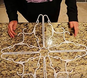 Learn to make a cheap easy DIY coat hanger snowflake