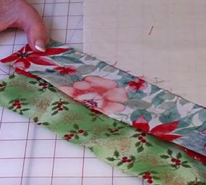 Learn this simple quilted table runner placemat DIY out of a jellyroll or scrap fabrics