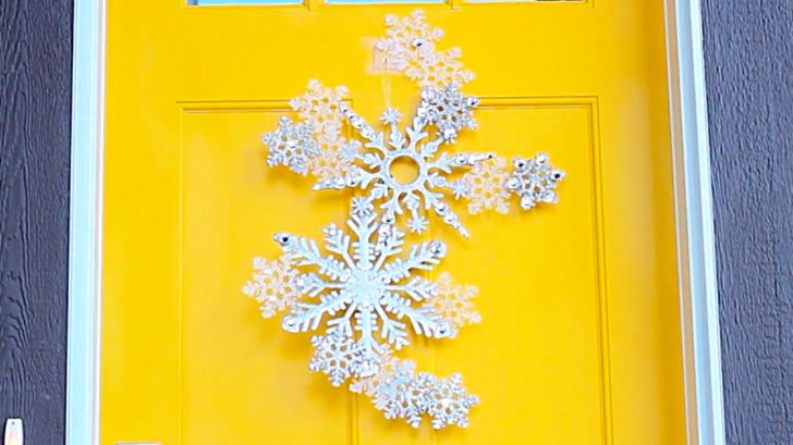 Learn to make this DIY Dollar Store Snowflake Door Hanging