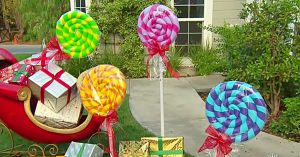 Learn to make these cheap giant yard lollipops from pool noodles this Christmas