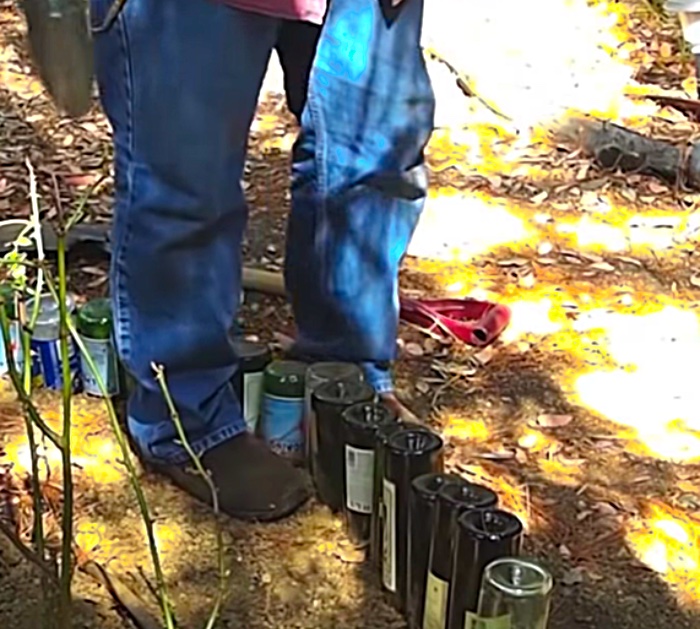 Make a DIY Edging for a Flower Bed Edging out of recycled upcycled wine bottles