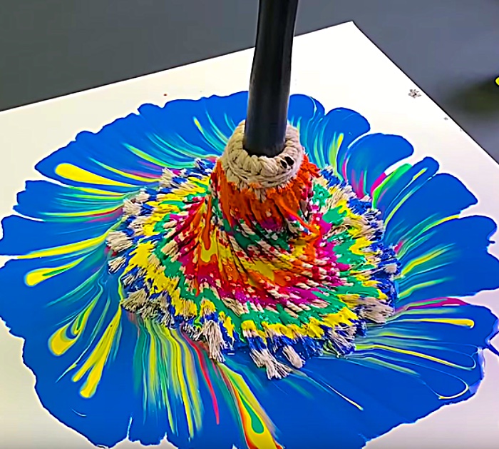 Why not try making a beautiful abstract work of art with paint and a mop