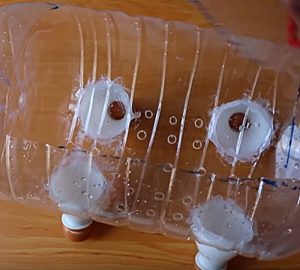 Learn to make a DIY Piggy Planter using recycled upcycled plastic water bottles