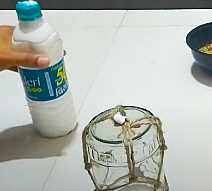 Glue A Twine Basket Around A Mason Jar To Make a Lantern