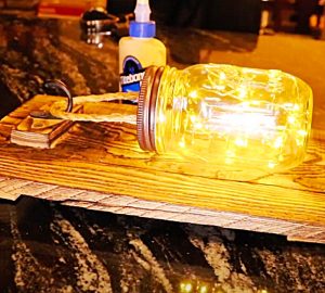 Stuff Battery-Operated Fairy Lights Inside a Mason Jar To make a Rustic Luminary