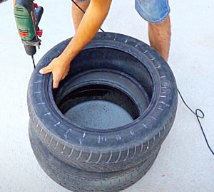 Drill Holes In An Old Tire To Make a DIY Tire Seat